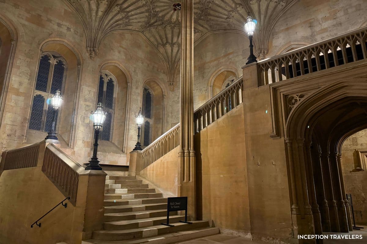 Fan-vaulted stone staircase at Christ Church College lined with lantern posts, famous from the Harry Potter films