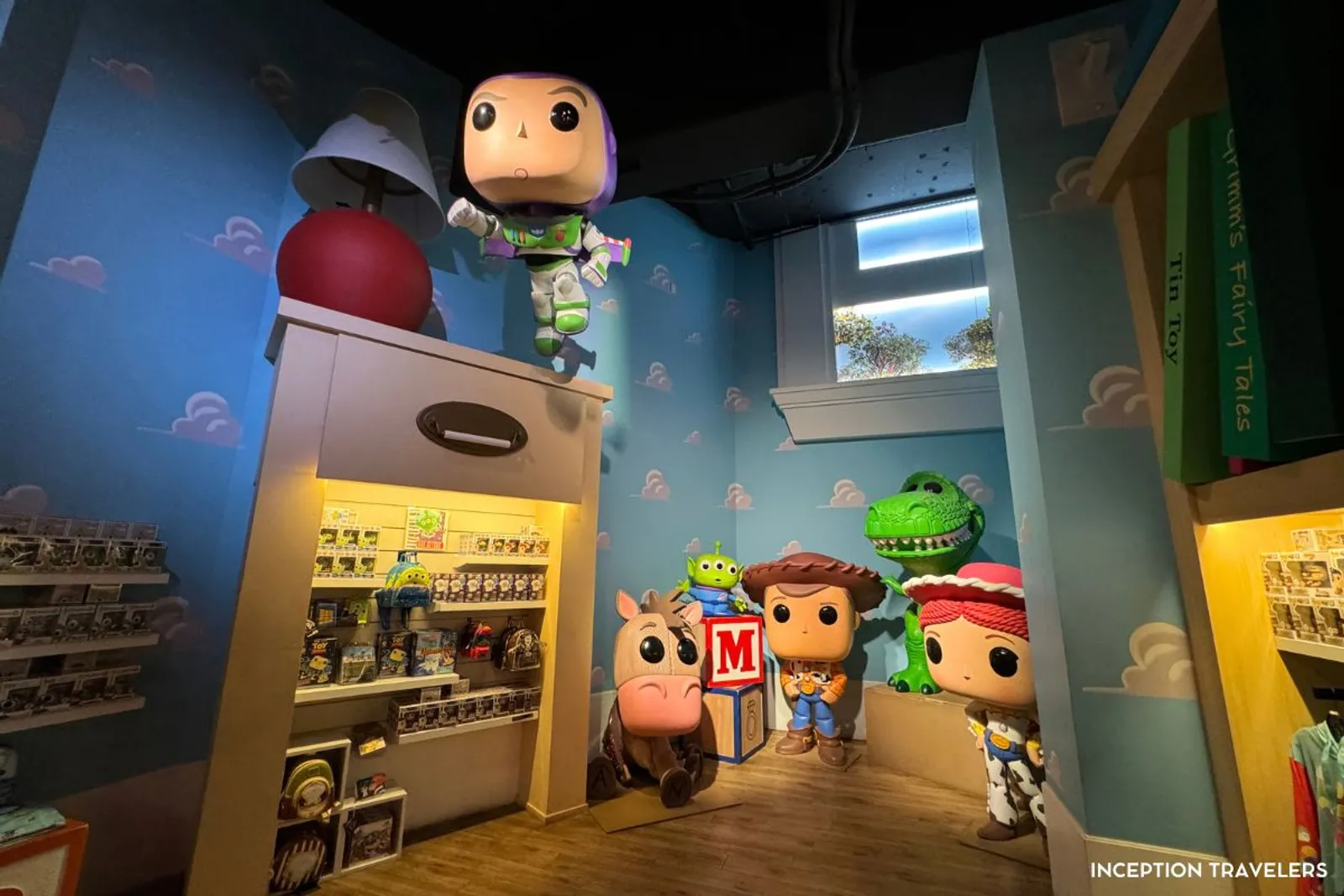 Giant Toy Story Funko figures in a cloud-wallpapered corner of the Hollywood Funko store