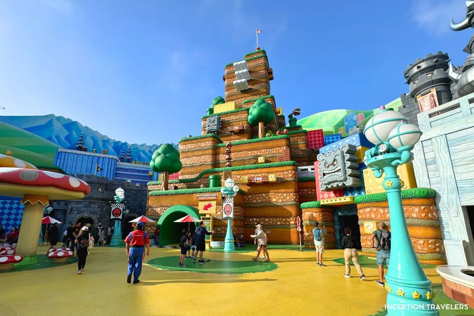 Super Nintendo World courtyard with the Mario Kart castle, Thwomp blocks and giant mushrooms