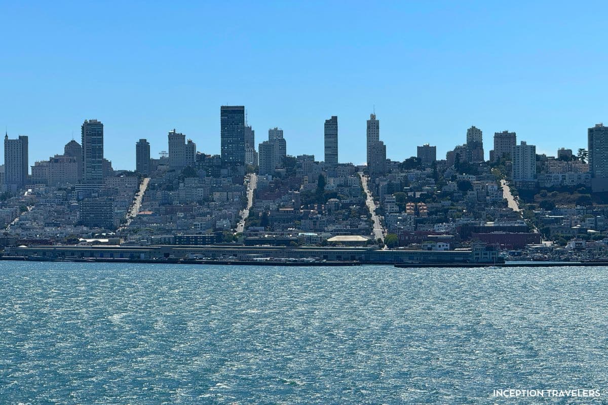 San Francisco's skyline and steep streets seen across the bay from the Alcatraz ferry